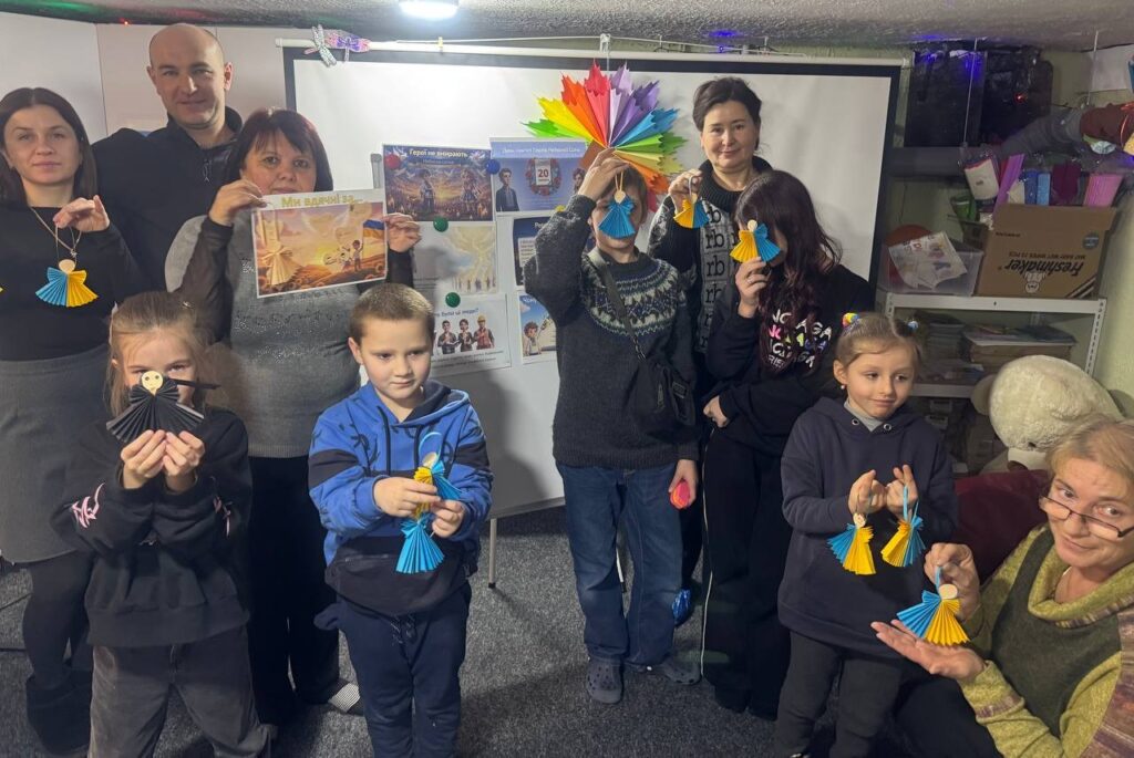 Учасники пам'ятного заходу з нагоди річнгиці російського вторгнення в Україну